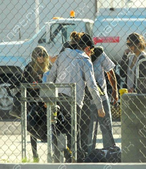 MK, Ashley & Max land at a private airport in L.A