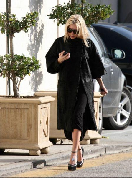 Ashley out and about in a black fur coat