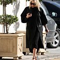 Ashley out and about in a black fur coat